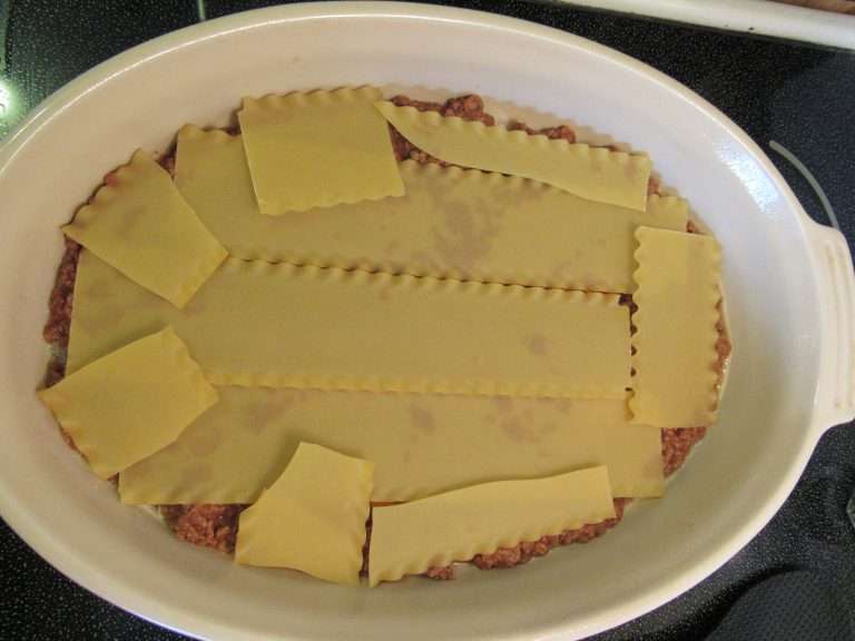 Layers of ground meat and lasagna noodles.