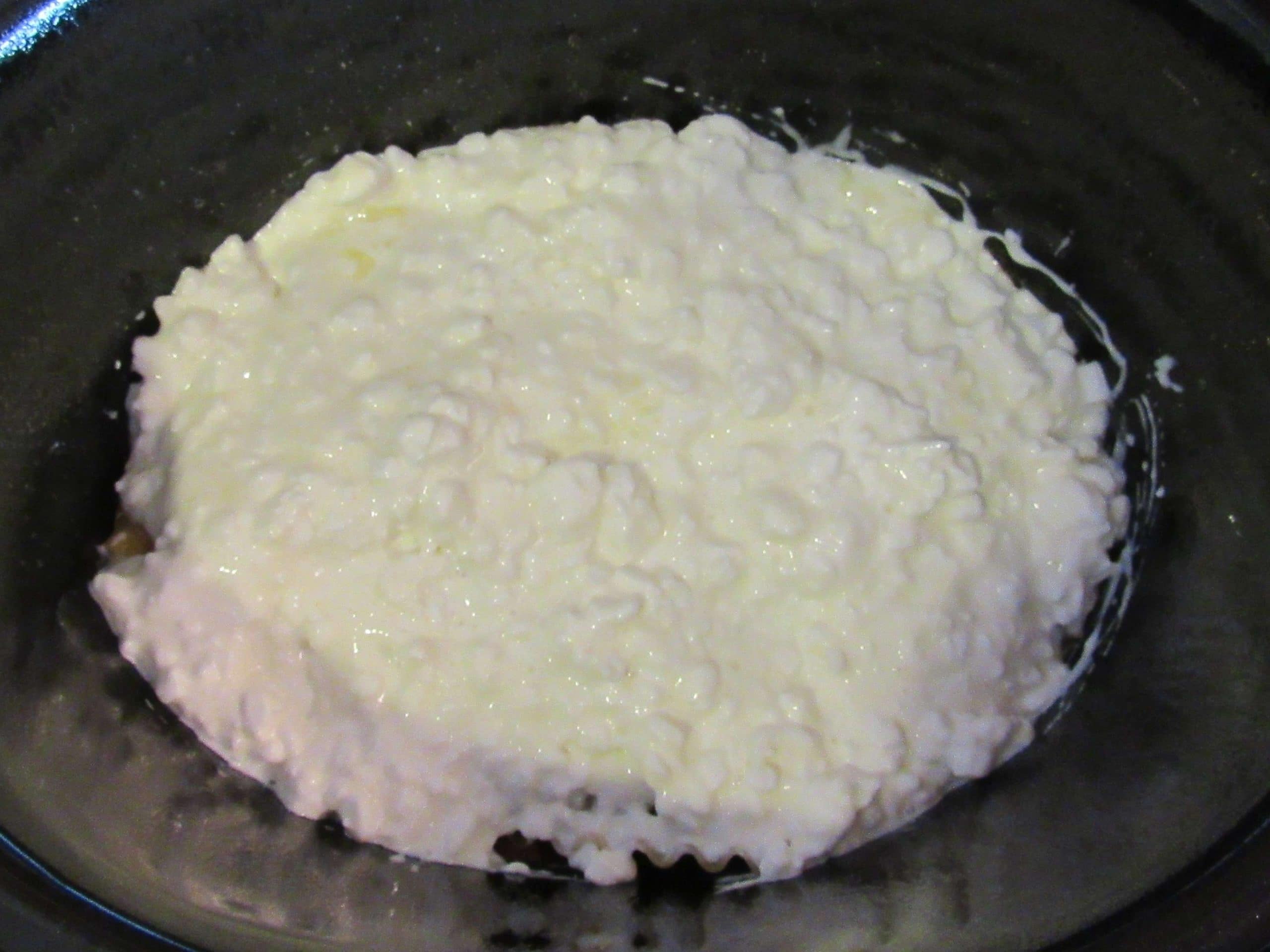 Cottage cheese layered into a lasagna during preparation Cottage cheese layered into a lasagna during preparation