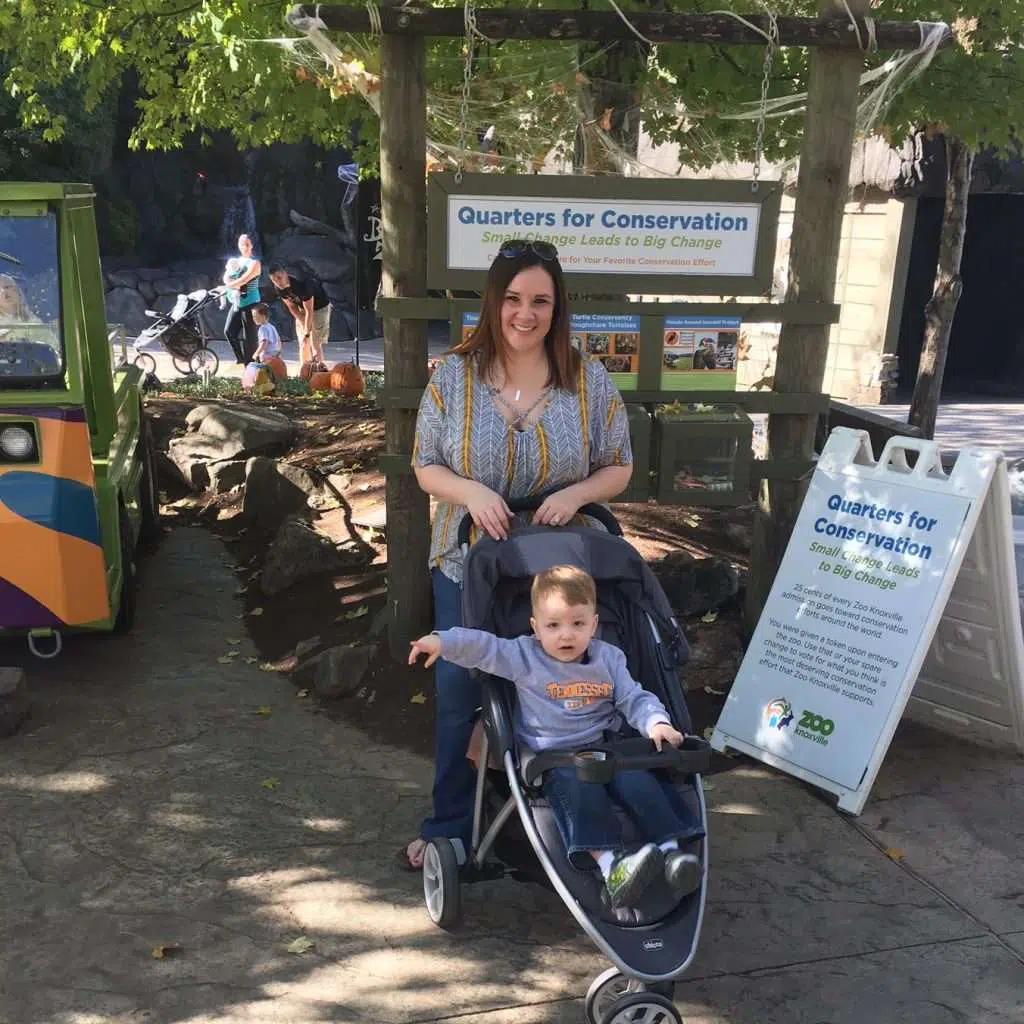 mom and son with stroller at entrance to zoo in Knoxville, TN