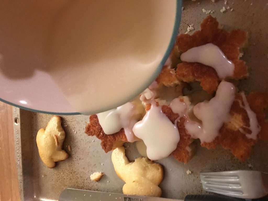 The Easiest Coconut Cake Recipe Ever 5 coconut mixture getting poured on top of coconut cake snowflakes
