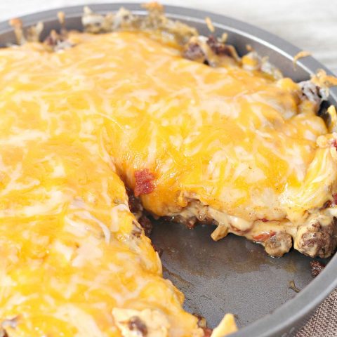 Cheesy Taco Casserole in pan with slice removed.