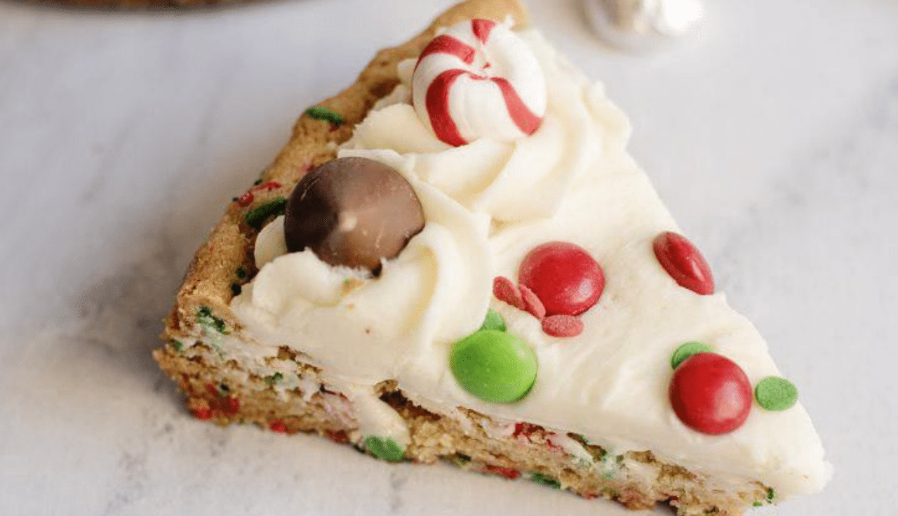 cookie with frosting and christmas colored candy