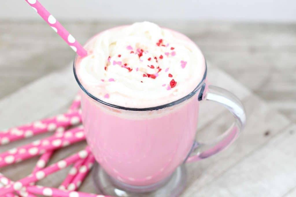 Strawberry Hot Chocolate 3 strawberry hot chocolate topped with whipped cream and sprinkles