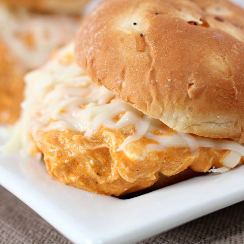 Creamy Crockpot Buffalo Chicken Sliders on white platter