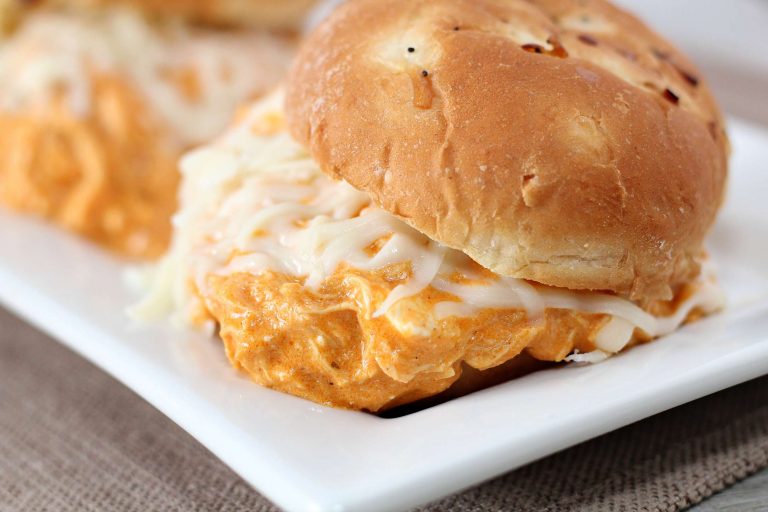 Creamy Crockpot Buffalo Chicken Sliders on white platter