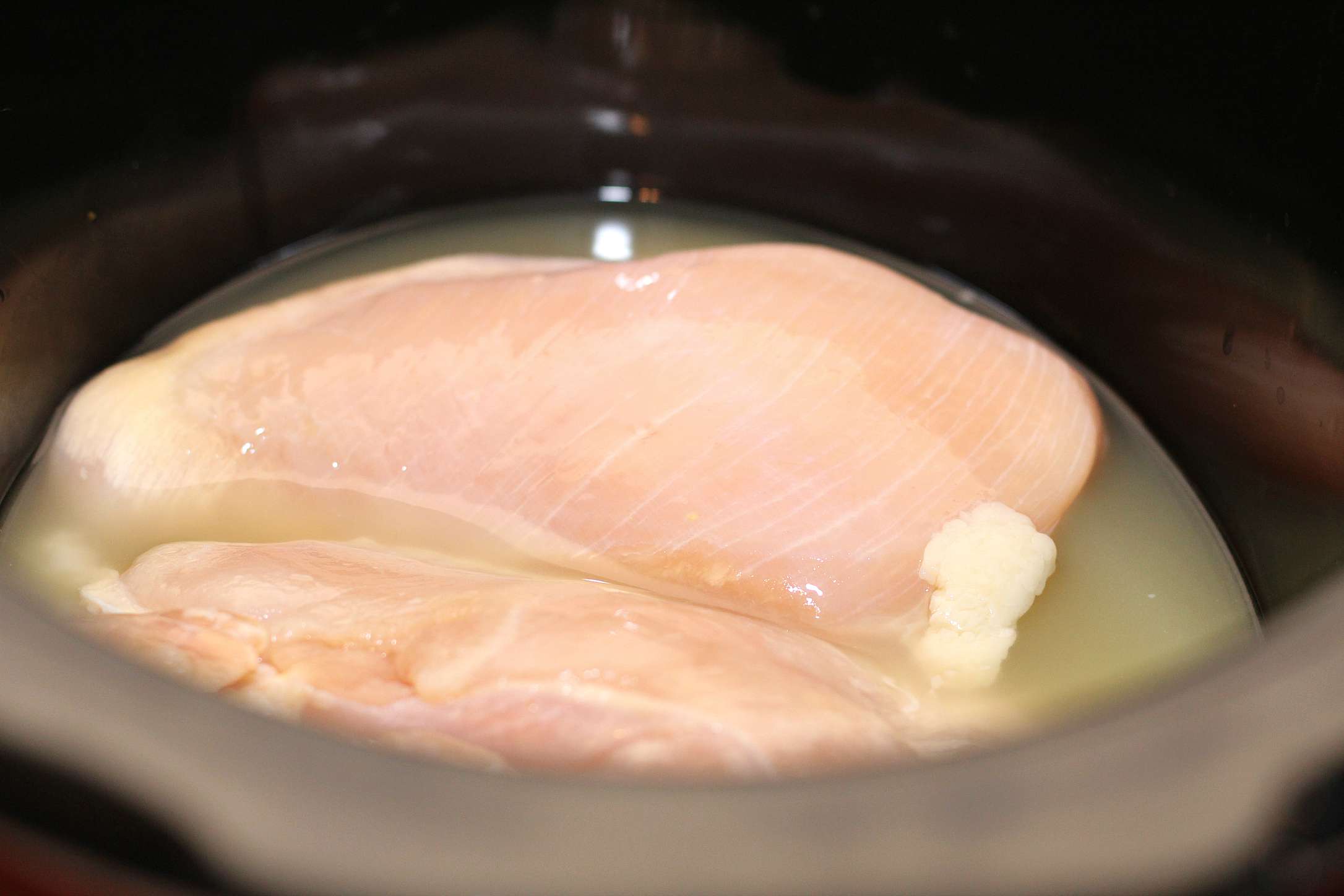 Chicken in broth in slow cooker