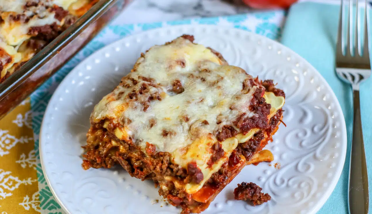 A single serving of ravioli casserole on a white serving plate.