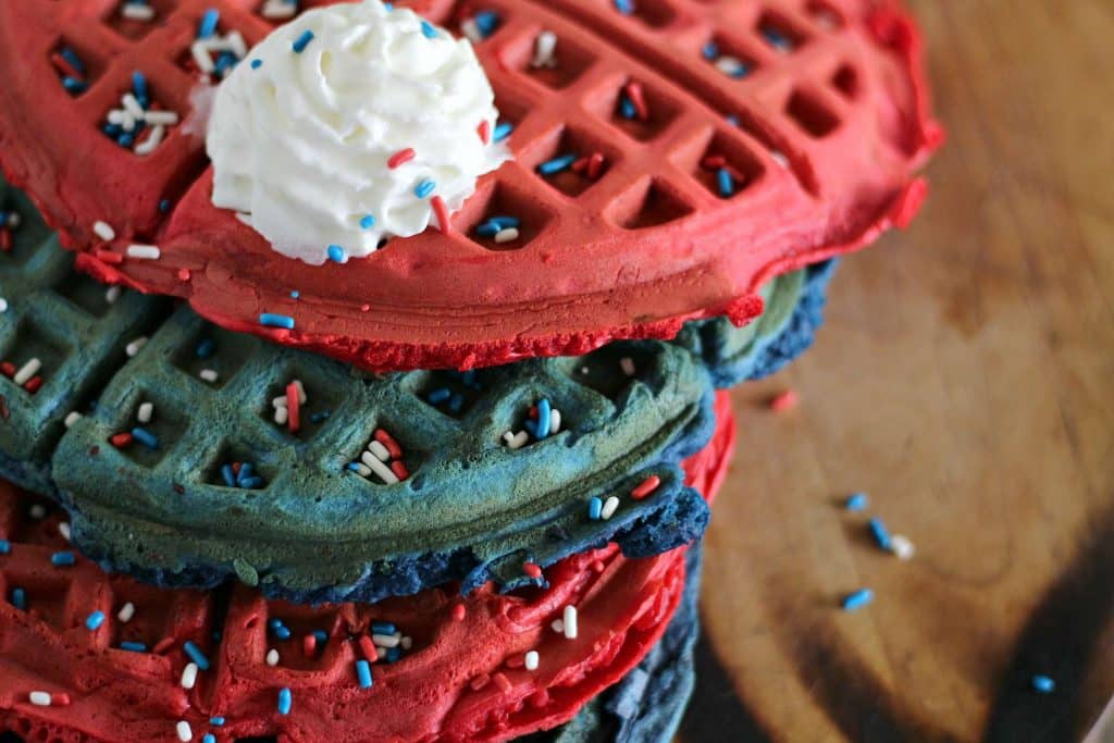 Red White and Blue Waffles 8 Top angle shot of a stack of red, white, and blue waffles on a plate.