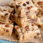 salted caramel chocolate chip cookie bars on blue plate