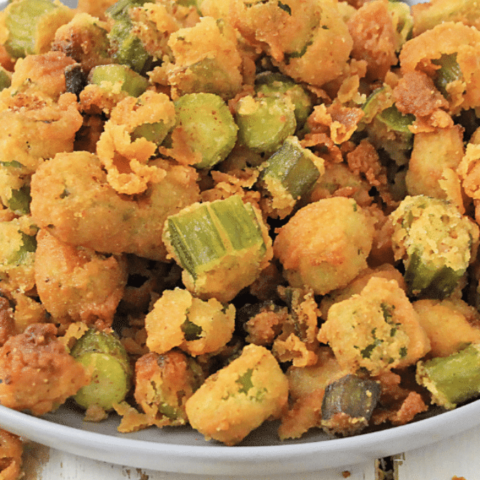 Fried Okra Recipe 7 white plate of fried okra on wooden background