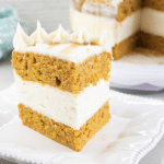 pumpkin cake with no bake cheesecake layer on white plate