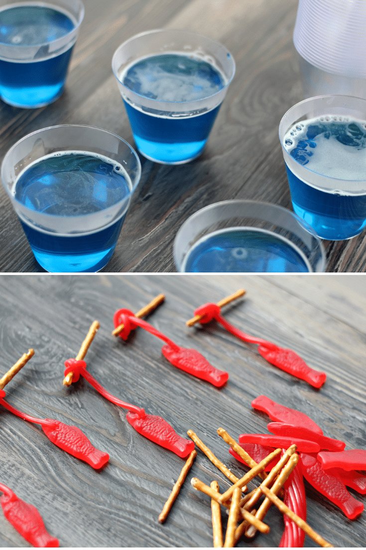 blue jello on top, swedish fish on pretzel rods on bottom