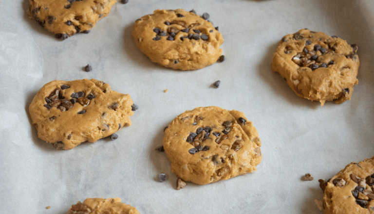 pumpkin cookies on cookie sheet