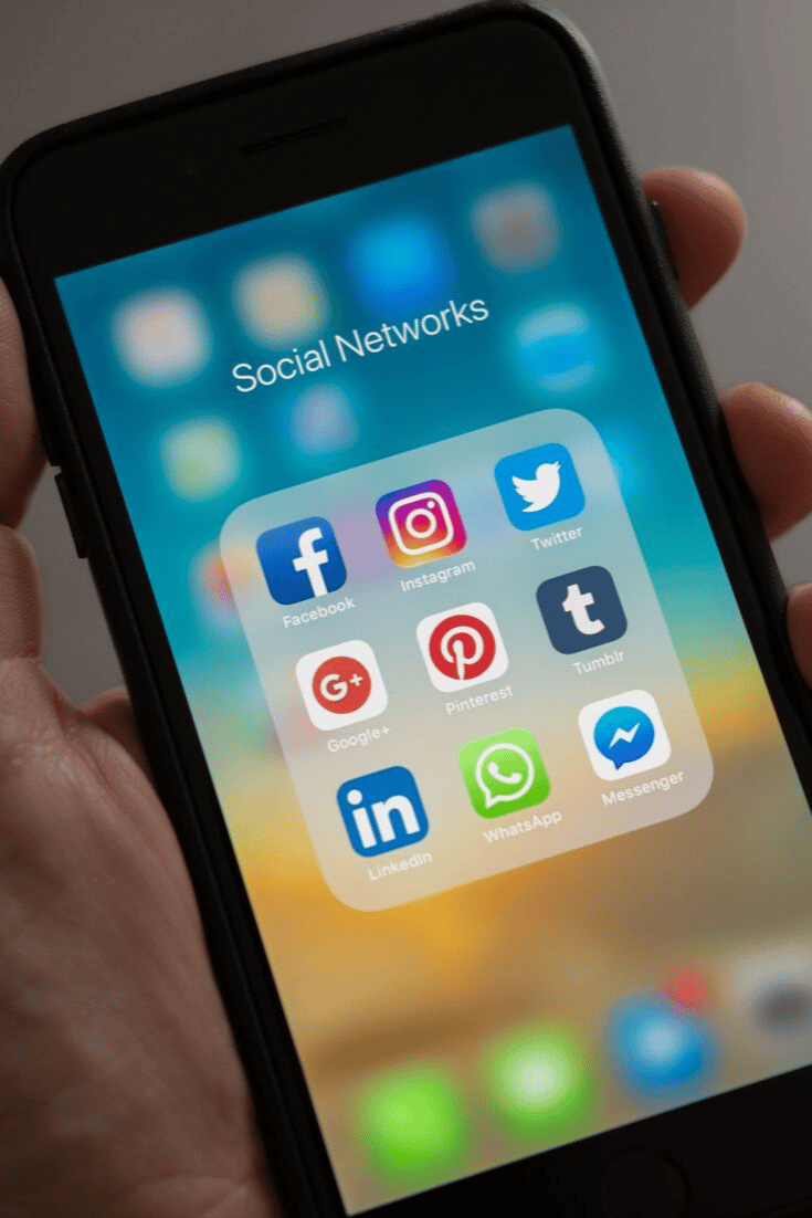 cell phone showing social media icons