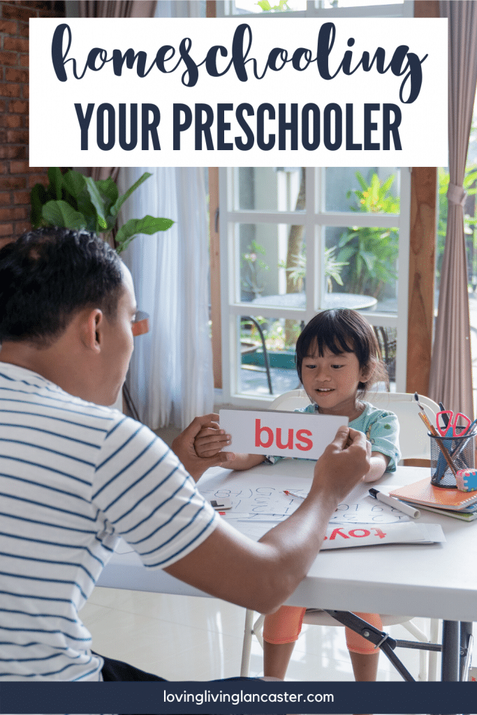 man teaching child to read