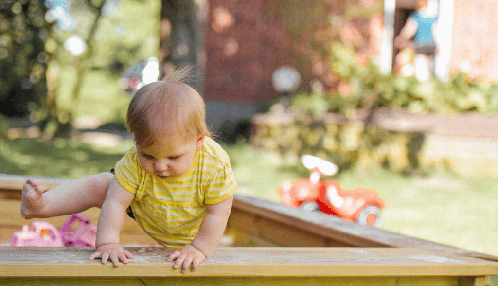 Outdoor Activities To Enjoy With Your Toddler 3 toddler climbing out of sandbox