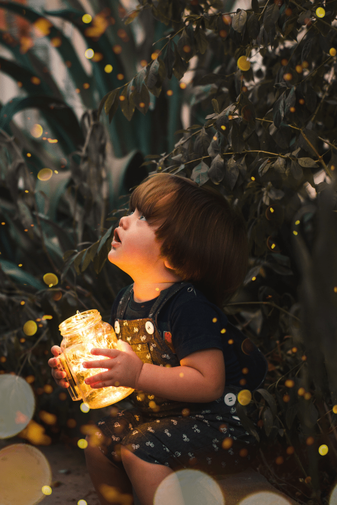 Outdoor Activities To Enjoy With Your Toddler 6 child catching fireflies in jar