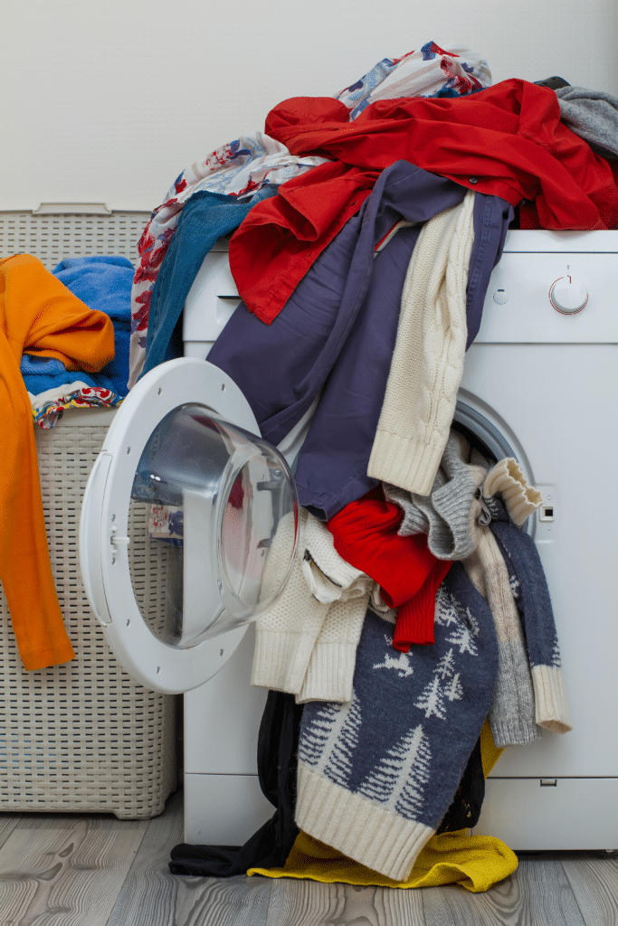 How To Stay Ahead of The Laundry Game 11 laundry pouring out of washing machine