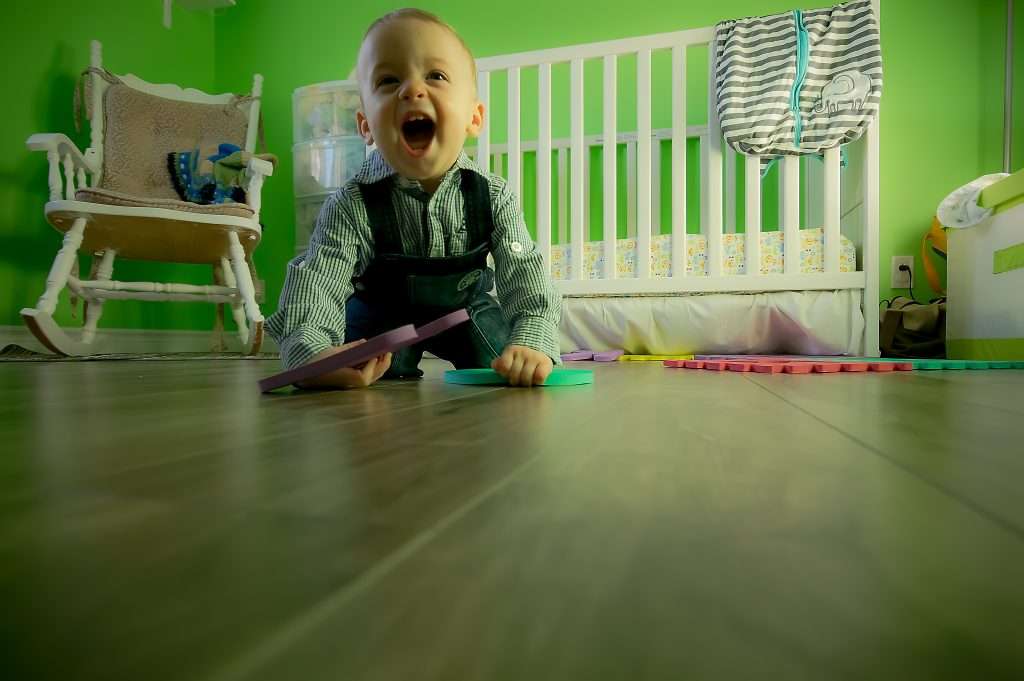 4 Tips to Keep Your Toddler From Taking Their Diaper Off 3 full length of boy sitting on floor 315265