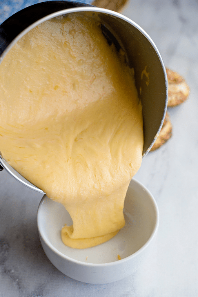 Soft Pretzels with Biscuit Dough 24 Cheese sauce poured into a white ramekin.