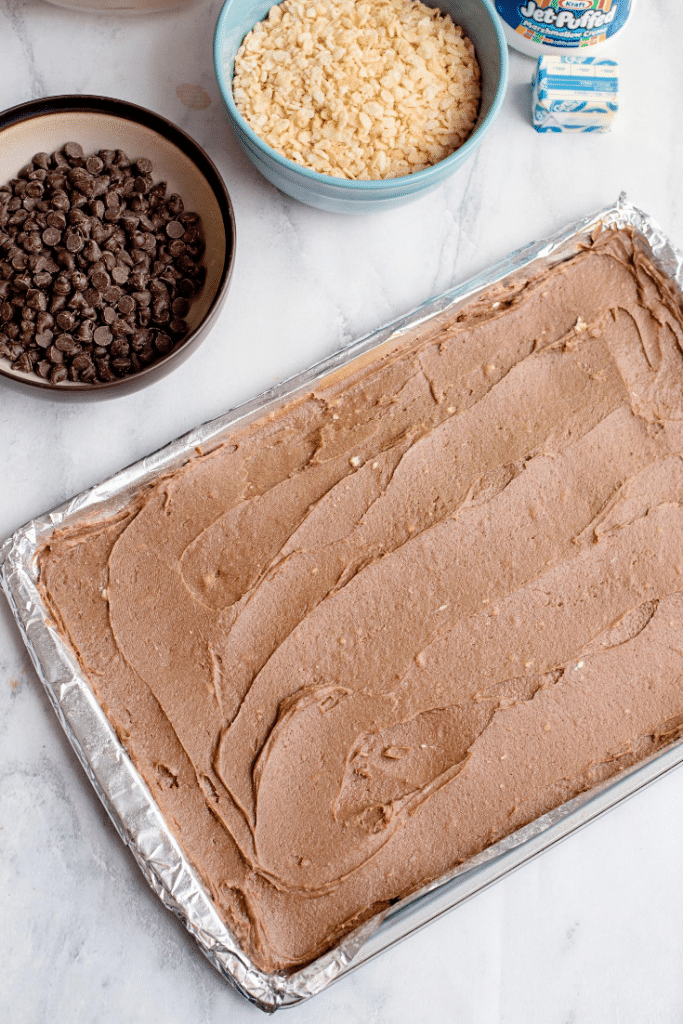 Chocolate Marshmallow Bars 18 Chocolate marshmallow bars batter spread evenly on a prepared baking sheet.