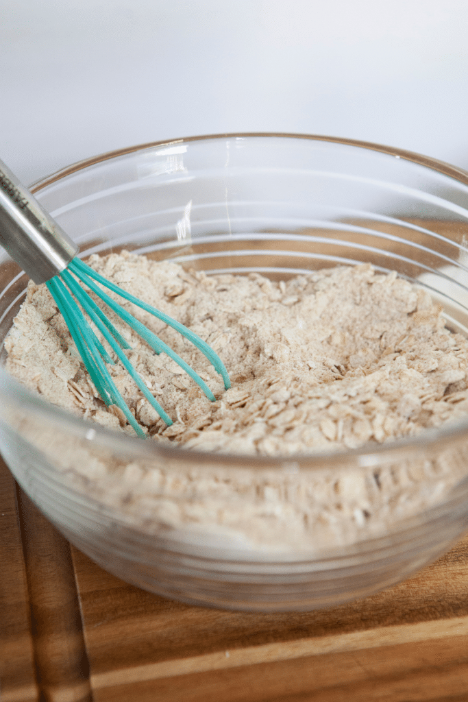 Easy Apple Crisp 11 apple crisp ingredients mixed in a bowl