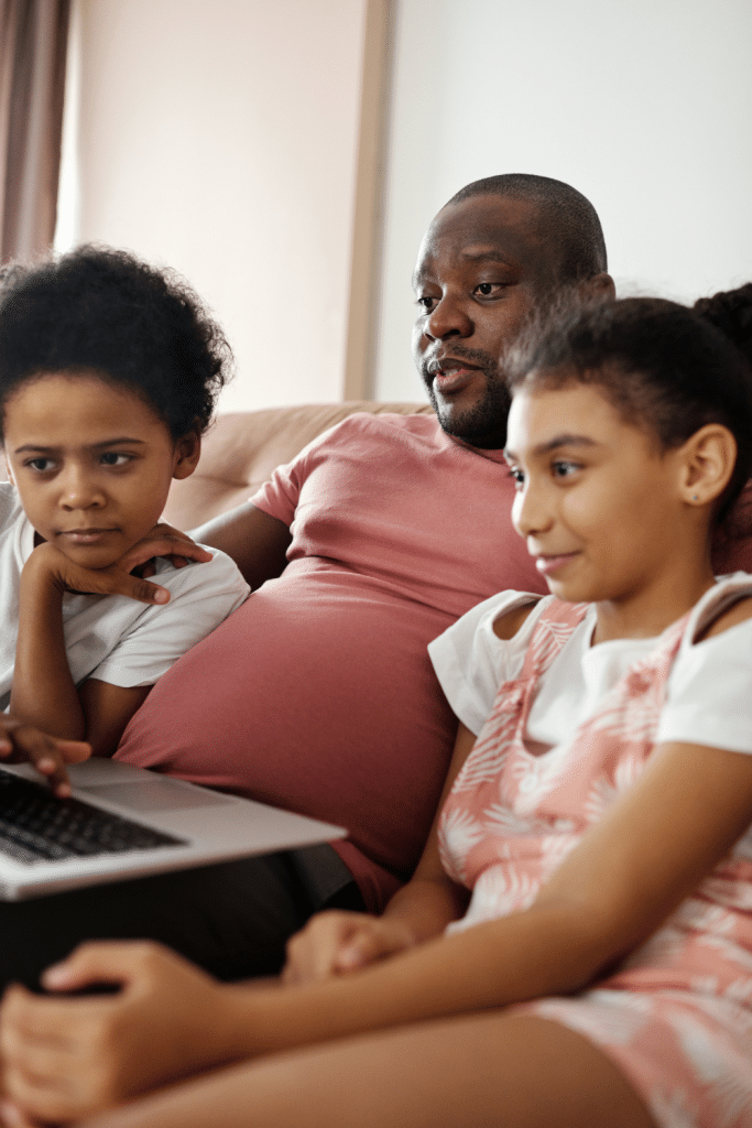 10 Ideas to Keep Your Kids Busy at Home 8 family watching tv together