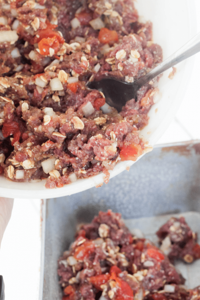 Venison Meatloaf 10 Venison Meatloaf ingredients mixed in white bowl