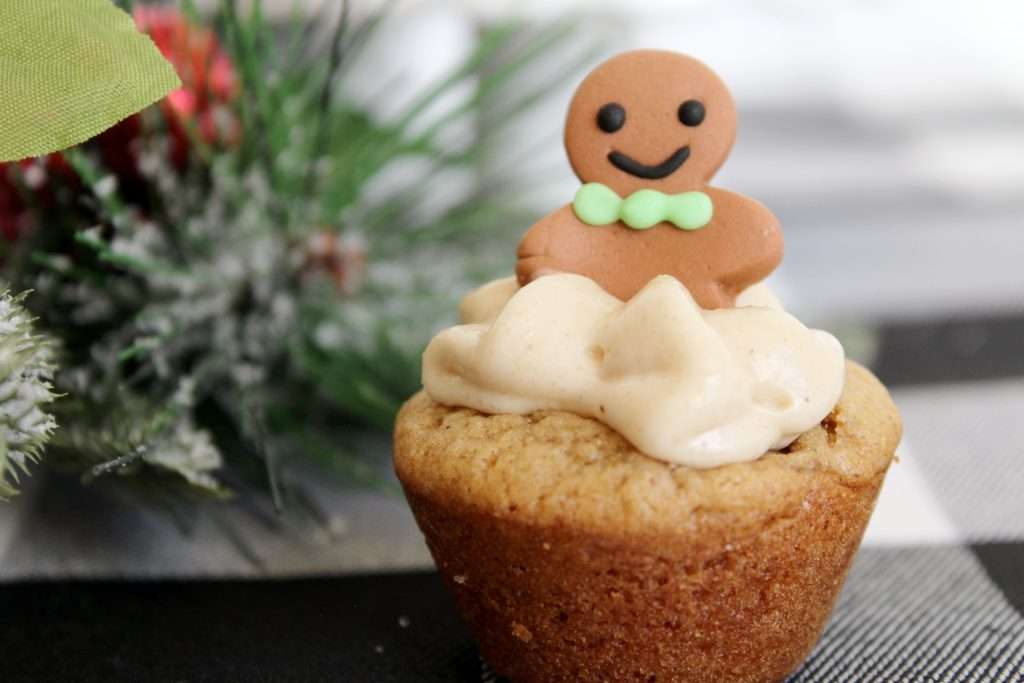 Gingerbread Cupcakes 9 Close up of a gingerbread cupcake with cream cheese filling and a gingerbread man.