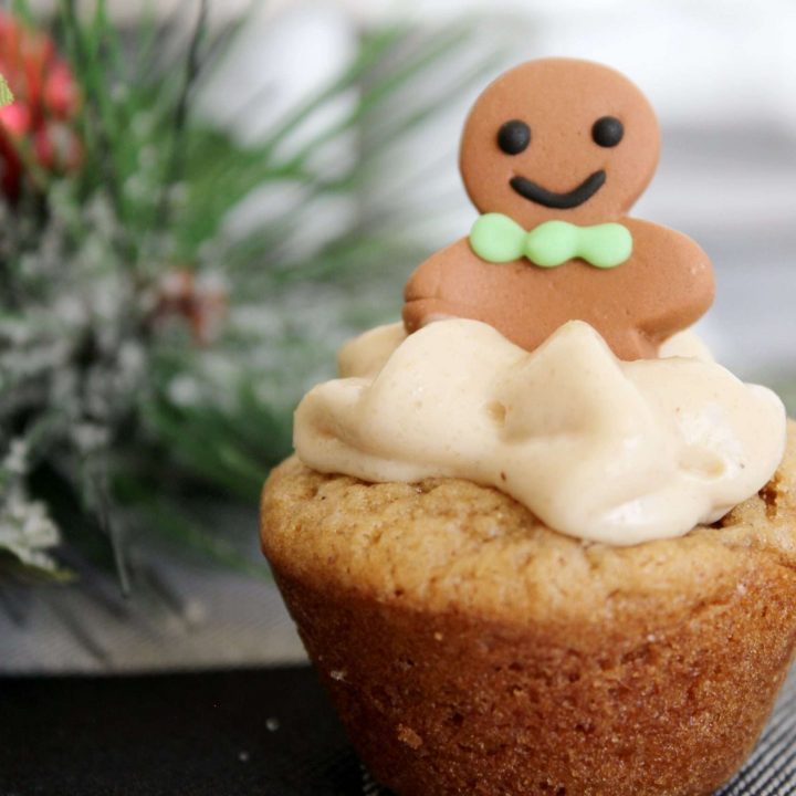 Gingerbread Cupcakes 10 Close up of a gingerbread cupcake with cream cheese filling and a gingerbread man.
