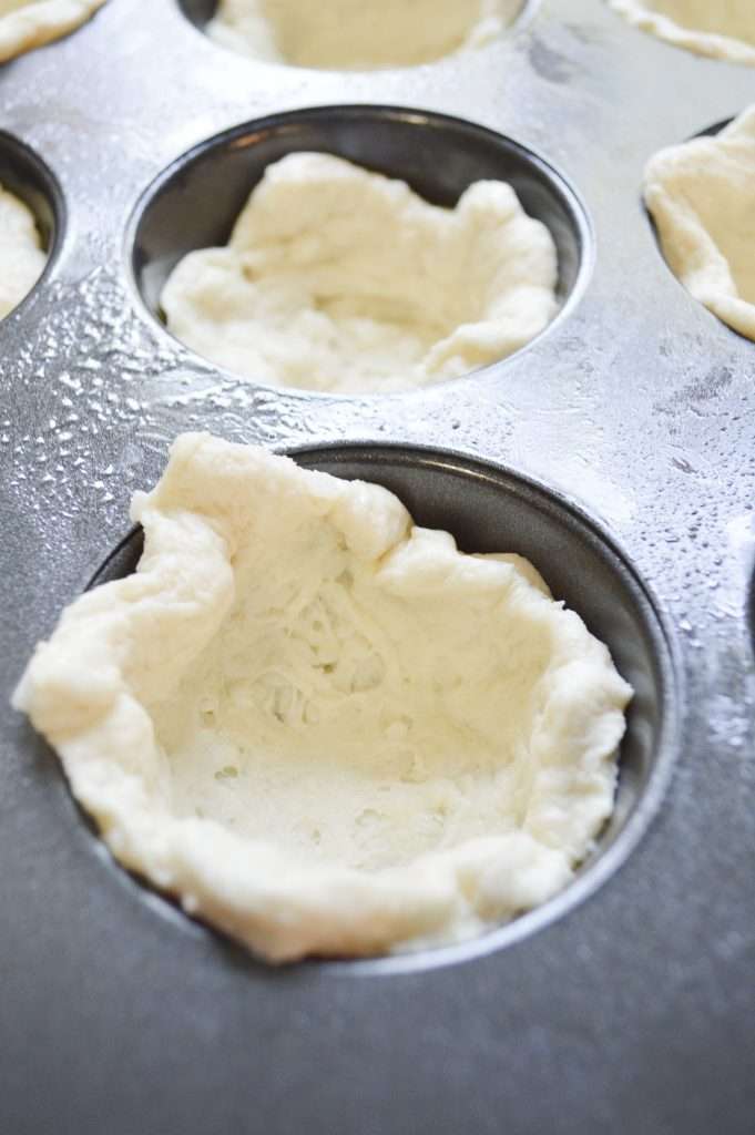 Taco Biscuit Cups 8 Canned biscuit dough pressed into cupcake pan.
