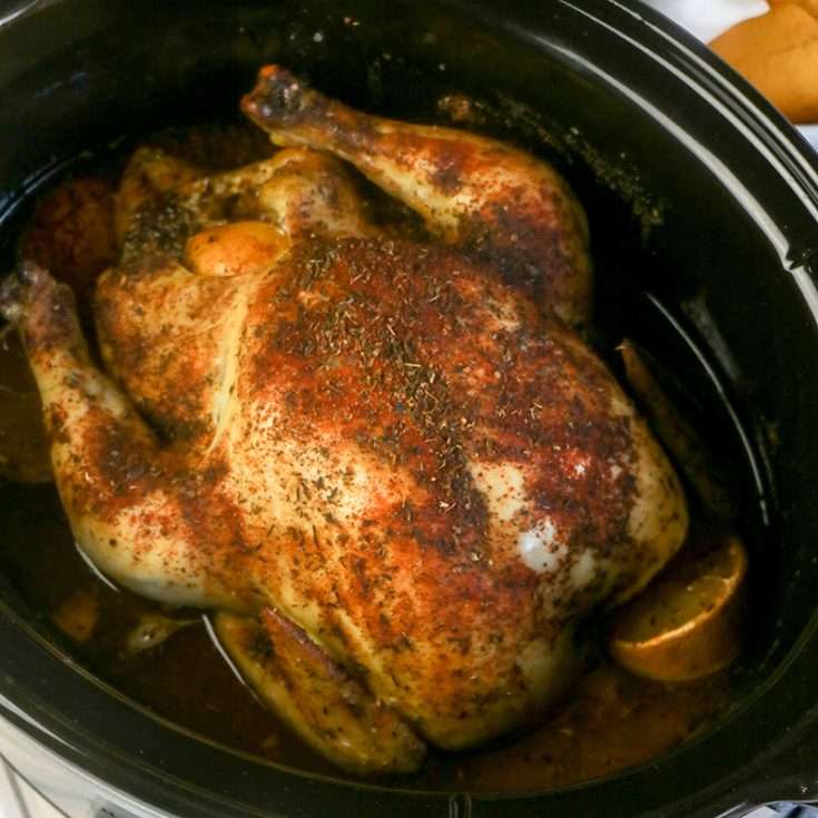 Slow Cooker Whole Chicken Recipe with Gravy 2 Engagement chicken in slow cooker with lemon slice