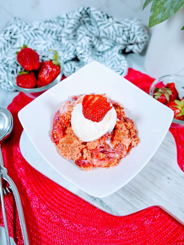 Easy Strawberry Dump Cake Dessert Recipe 29 Strawberries and cream cake mix crumble recipe on a plate