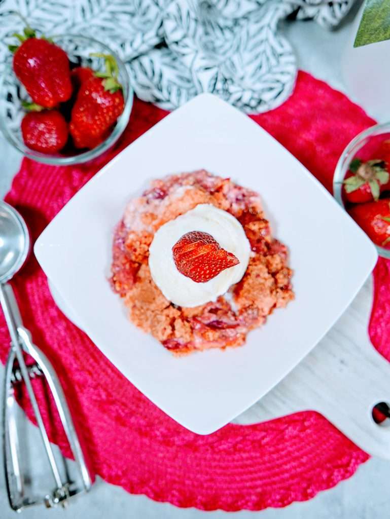 Easy Strawberry Dump Cake Dessert Recipe 4 Strawberries and cream cake mix crumble recipe on a plate