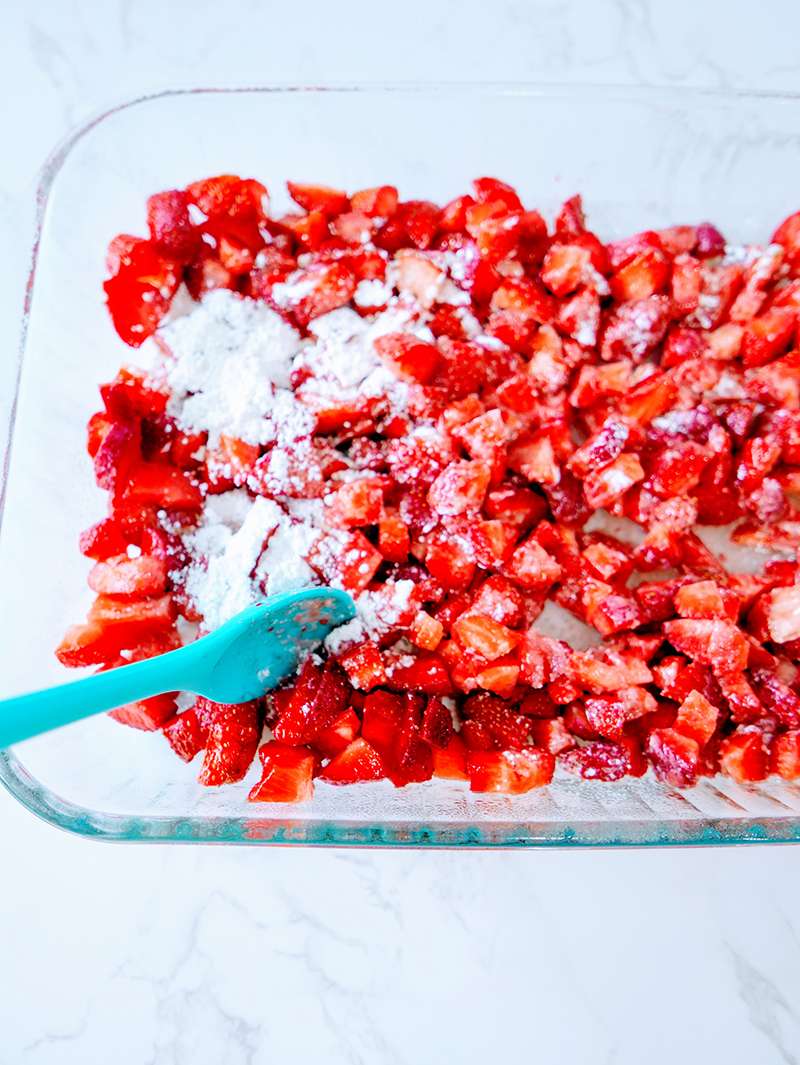 Preparing Strawberries and cream cake mix crumble recipe