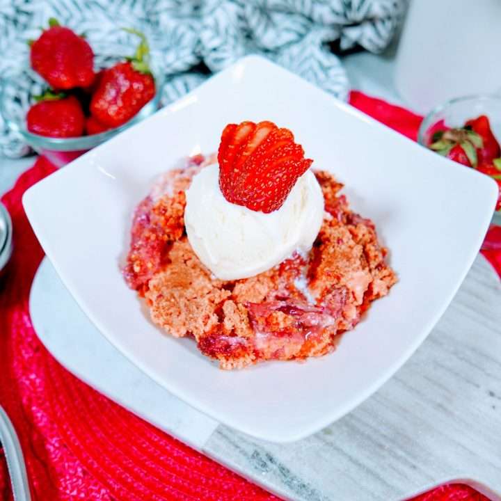 Easy Strawberry Dump Cake Dessert Recipe 8 Strawberries and cream cake mix crumble recipe on a plate