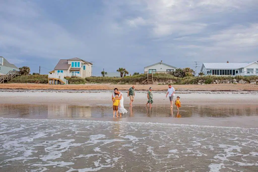 Family playing in water on beach in St. Augustine Florida 