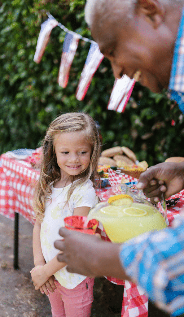 5 Easy Ways to Celebrate Grandparents this Grandparents Day 5 girl watching man pour lemonade
