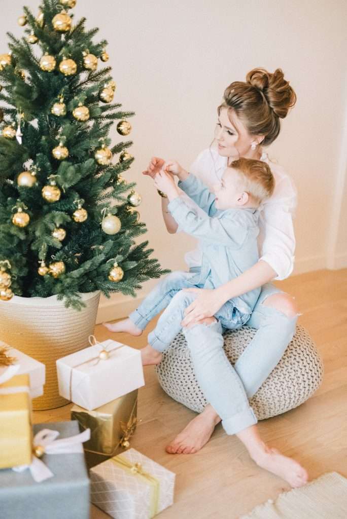 Christmas Gift Ideas for 5 Year Old Boys 6 mother and son hanging an ornament on the christmas tree
