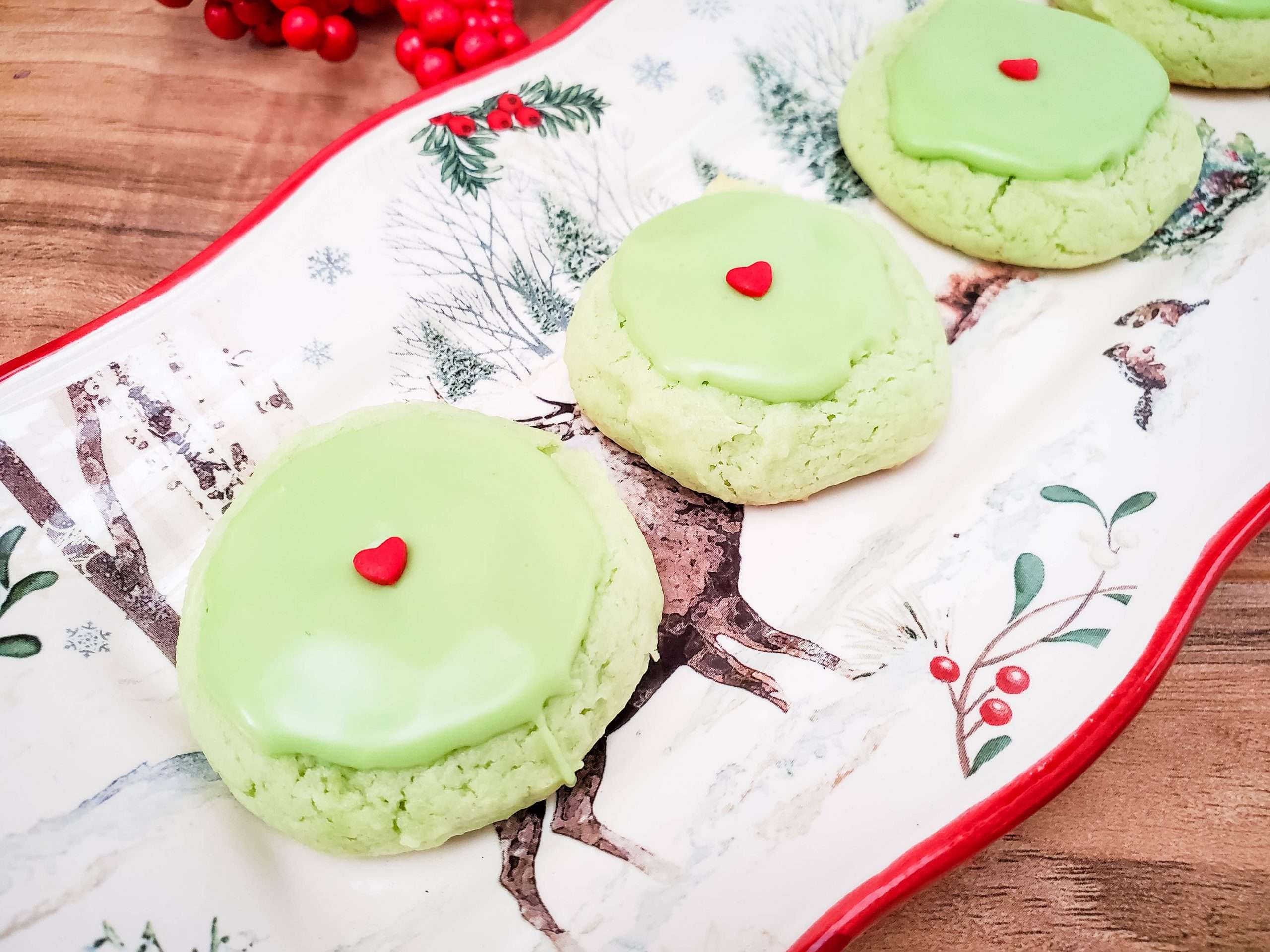 Christmas-themed plate with Grinch cookies.