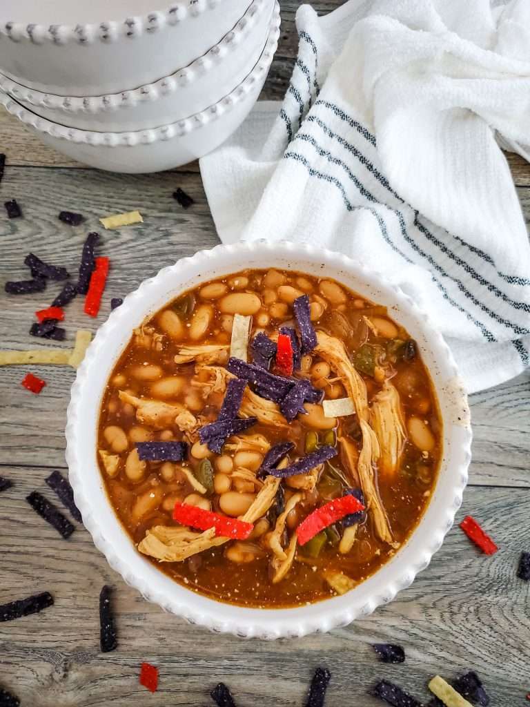How to Make Chicken Chili in Your Crock Pot 5 chicken chili in a bowl topped with tortilla strips