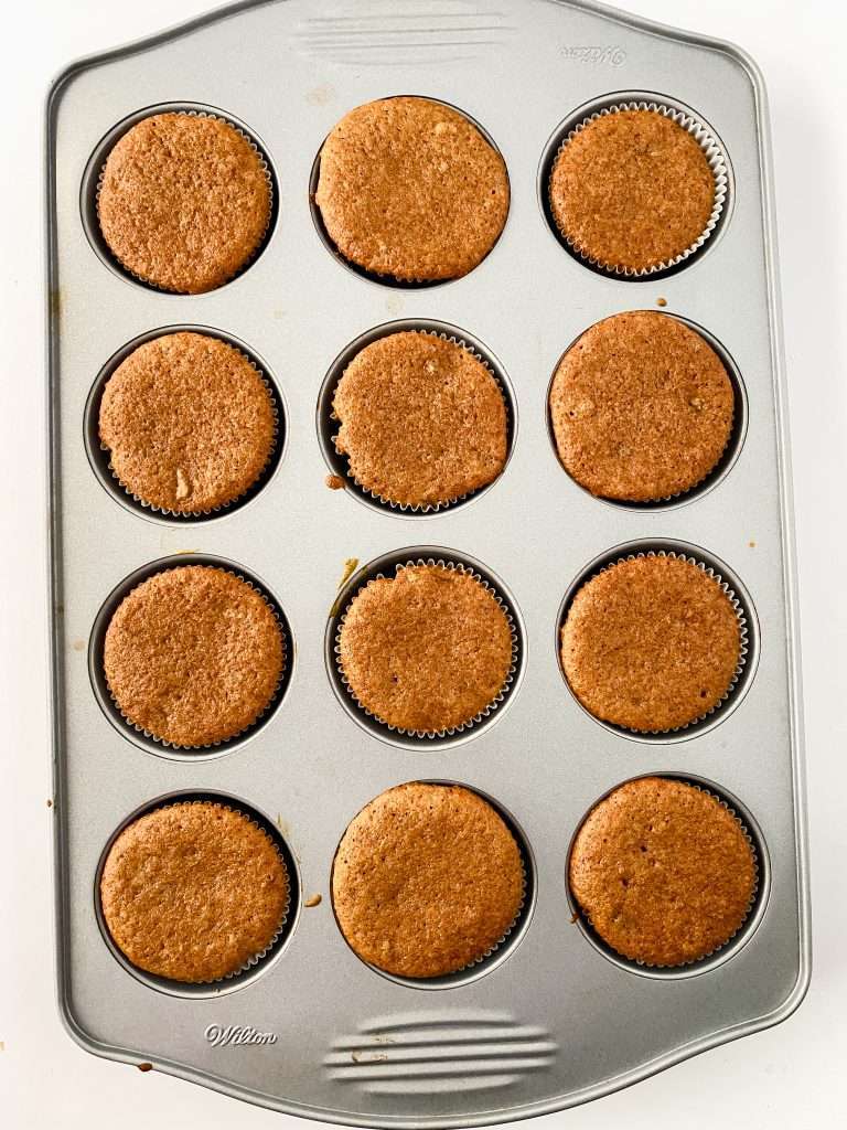Apple Cider Cupcakes 11 Baked apple cider cupcakes in a metal cupcake pan.