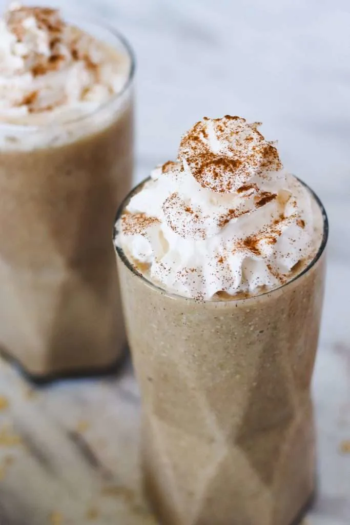 apple pie smoothie with whipped cream and cinnamon topping 