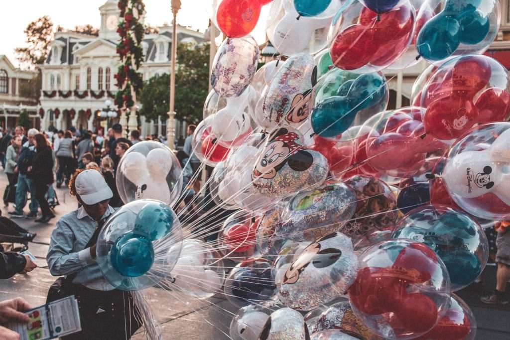 How to Celebrate Christmas at Disney World 5 red and green disney balloons for christmas