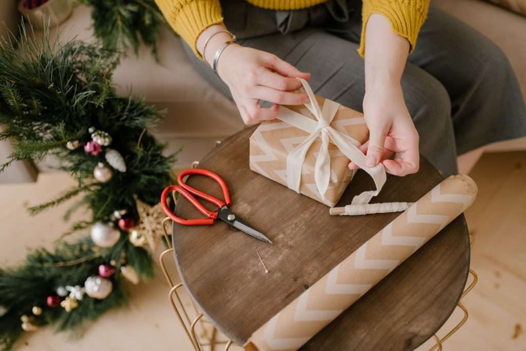 Woman wrapping a christmas present