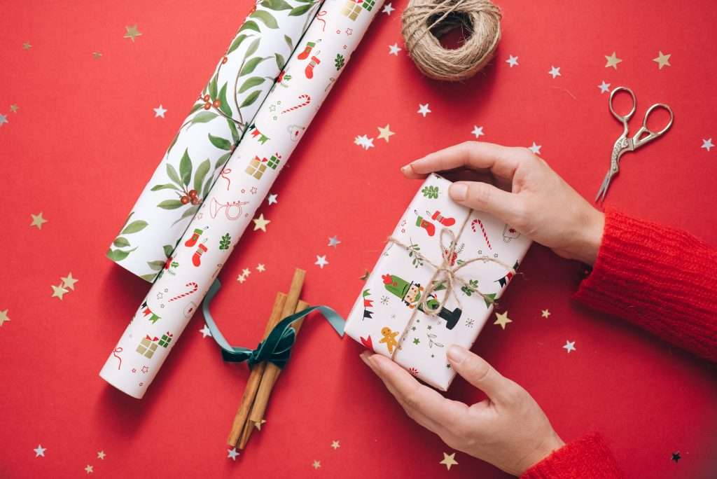 25 Stocking Stuffer Ideas for Kids Under 7 9 wrapping a christmas present