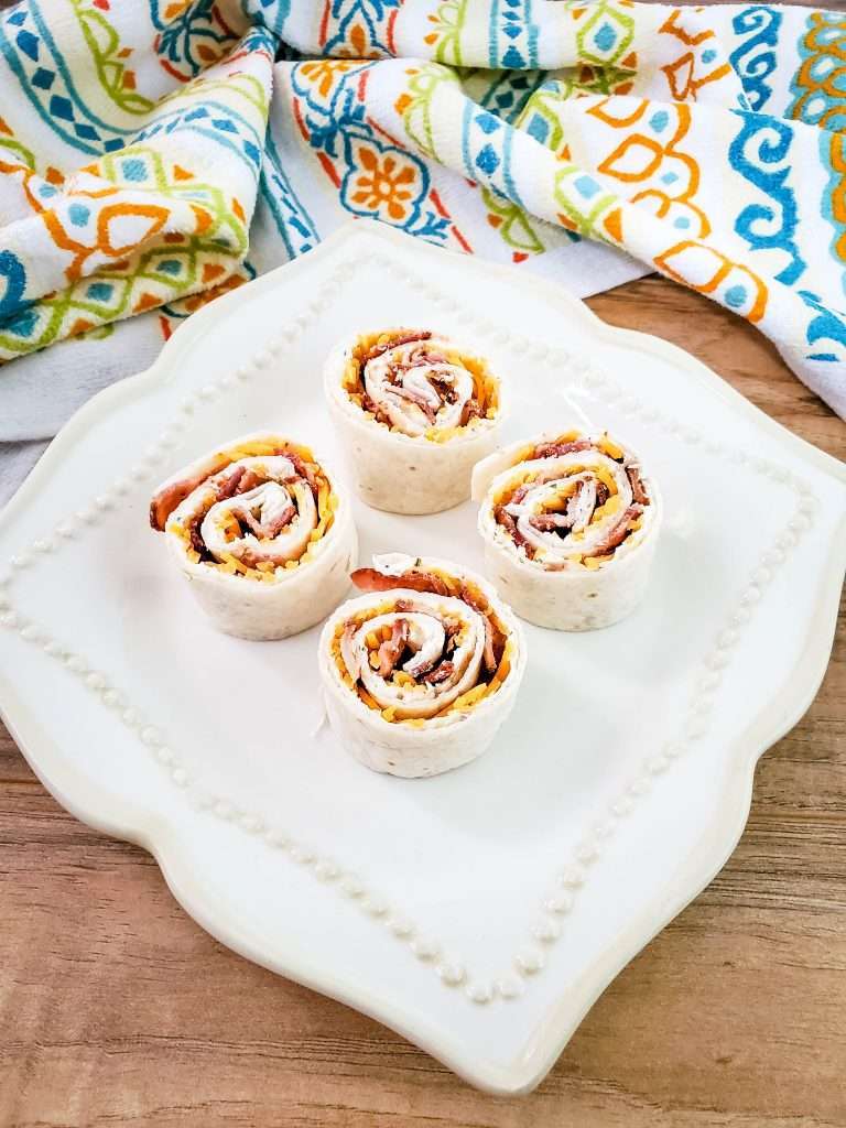 Cream Cheese Bacon & Ranch Pinwheels 5 Cream Cheese Bacon & Ranch Pinwheels on a white plate