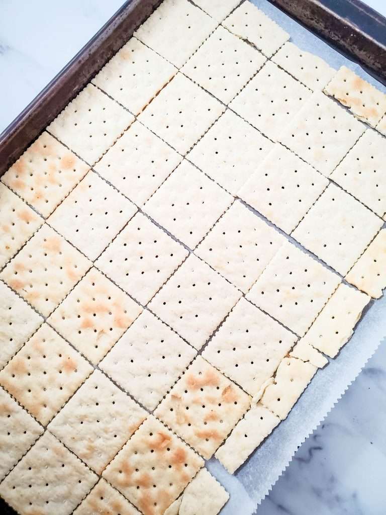 Christmas Crack 8 sheet pan with a layer of saltine crackers on it