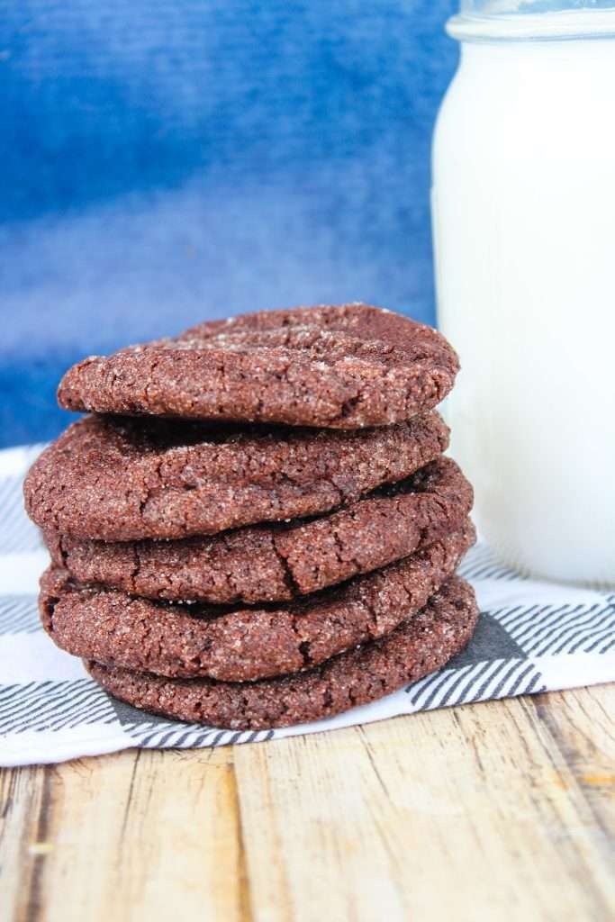 Chocolate Sugar Cookies 5 chocolate sugar cookies in a stack with a glass of milk