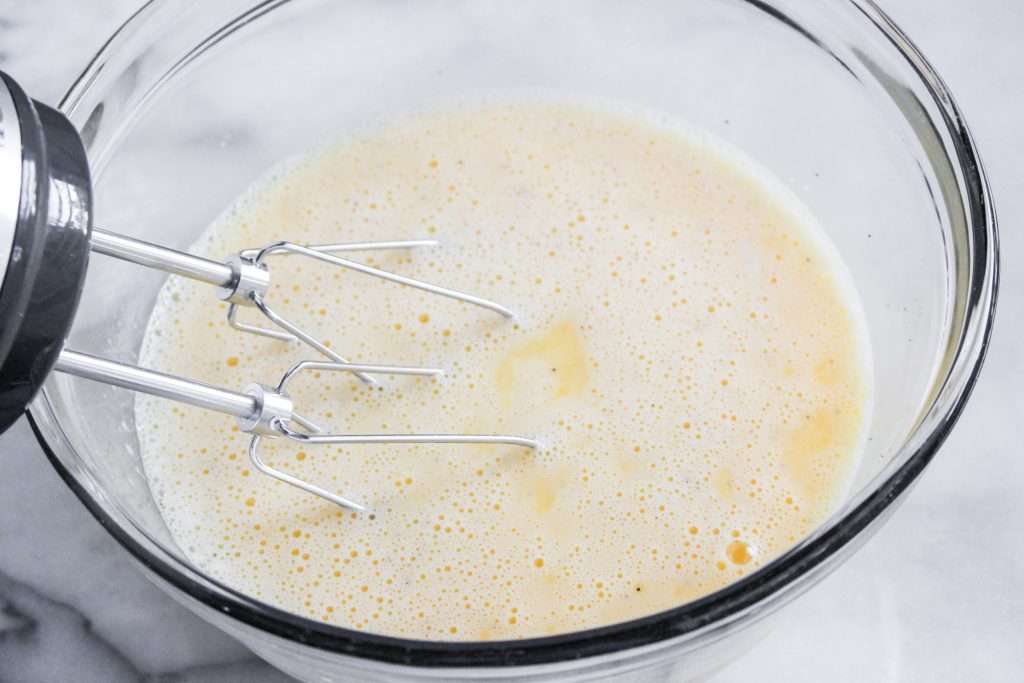 Christmas Breakfast Casserole 25 eggs beaten in a glass bowl